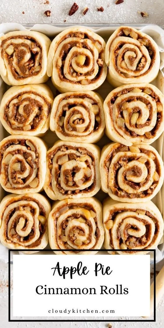 Delicious homemade apple cinnamon rolls with icing on a plate