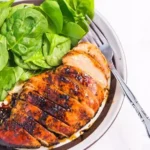 Baked Balsamic Chicken Breast 3 Baked balsamic chicken breast with herbs and spices on a plate