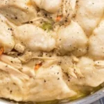 Chicken and Dumplings 3 Bowl of Chicken and Dumplings with fresh herbs and vegetables