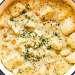 Chicken Dumpling Soup 3 Delicious Chicken Dumpling Soup served in a bowl with herbs and spices