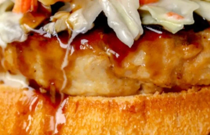 Grilled Chicken Teriyaki Burger served with fresh vegetables and spicy sauce