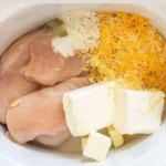 Crack Chicken 3 Delicious Crack Chicken served in a bowl with fresh herbs.