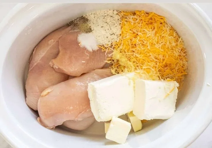 Delicious Crack Chicken served in a bowl with fresh herbs.