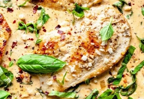 Creamy Parmesan Basil Chicken dish served with herbs and spices