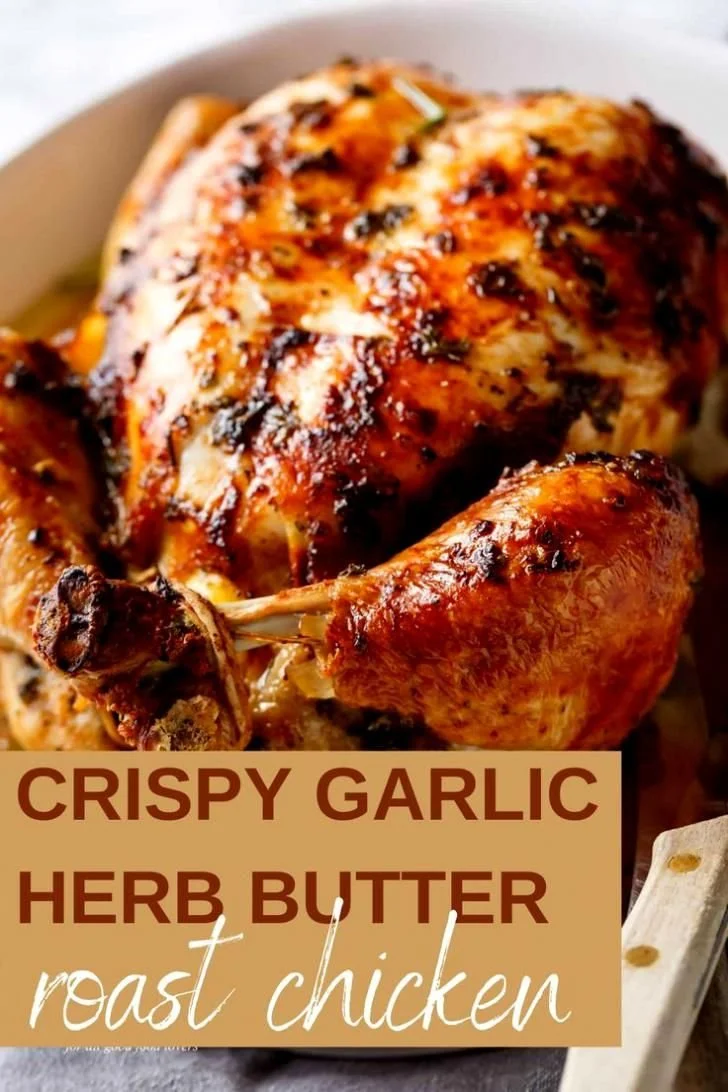 Crispy Garlic Herb Butter Roast Chicken garnished with herbs