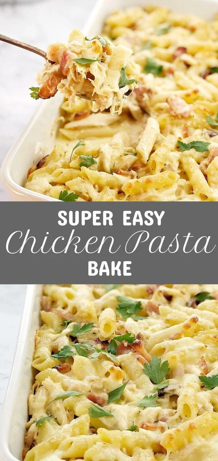Creamy chicken pasta bake topped with cheese and herbs, freshly prepared in a baking dish.