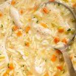 Easy Lemon Chicken Orzo Soup 3 Bowl of easy lemon chicken orzo soup garnished with herbs and lemon slices