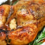 Garlic Lemon Roasted Chicken 3 Delicious Garlic Lemon Roasted Chicken garnished with herbs