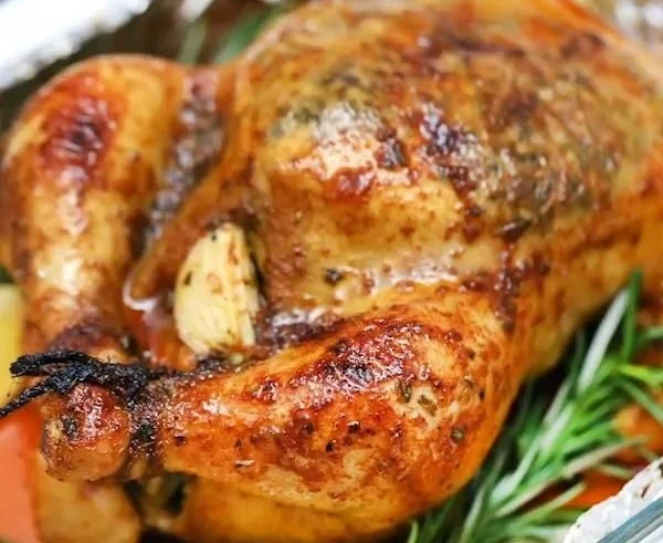 Delicious Garlic Lemon Roasted Chicken garnished with herbs