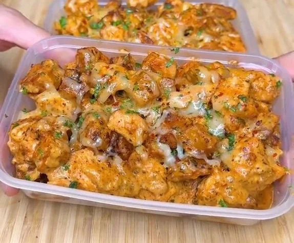 Garlic Parmesan Chicken served with cheesy potatoes on a plate
