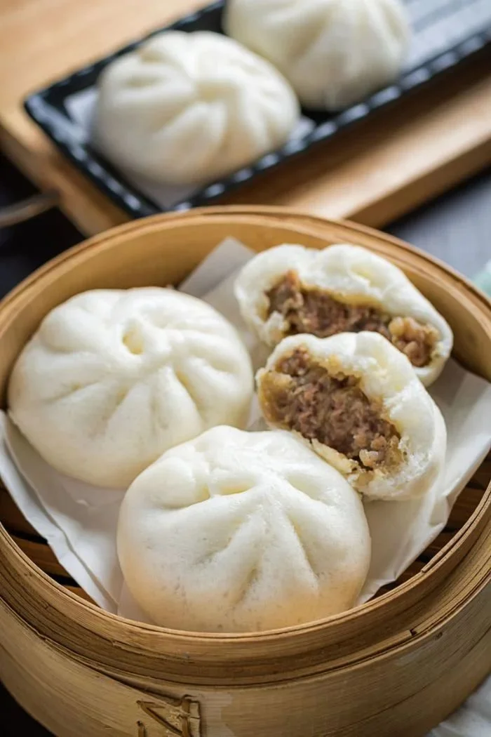 Gluten-free steamed bao buns served with filling in a traditional Chinese style