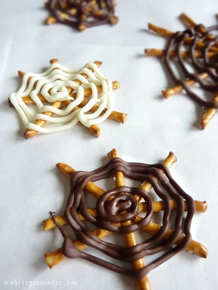 Chocolate Pretzel Spider Web Halloween treat with white icing stripes