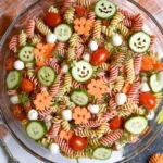 Halloween Pasta Salad 3 A colorful Halloween Pasta Salad with seasonal decorations and spooky shapes.