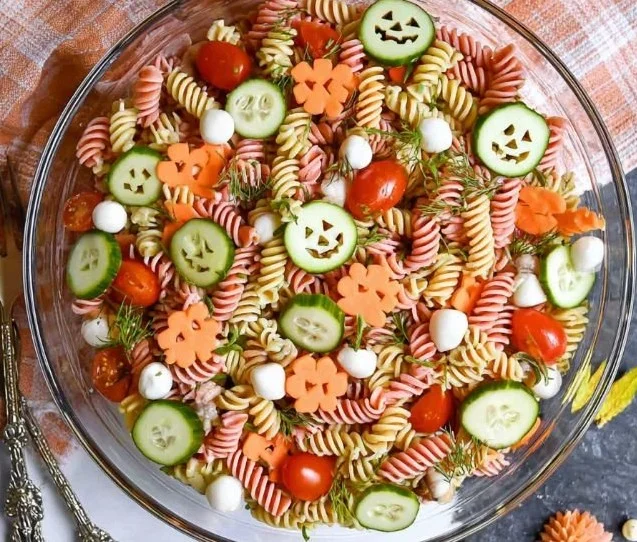 A colorful Halloween Pasta Salad with seasonal decorations and spooky shapes.