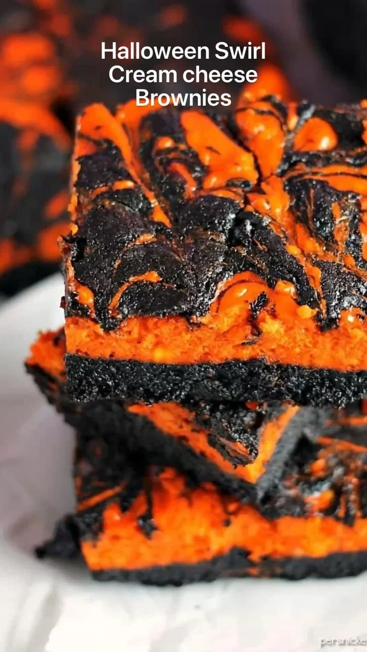 Delicious Halloween Swirl Cream Cheese Brownies with festive colors and creamy topping.
