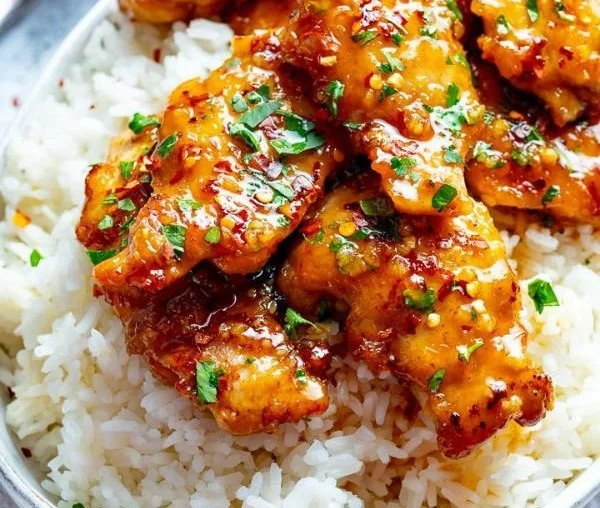 Delicious Honey Garlic Chicken Thighs served on a white plate