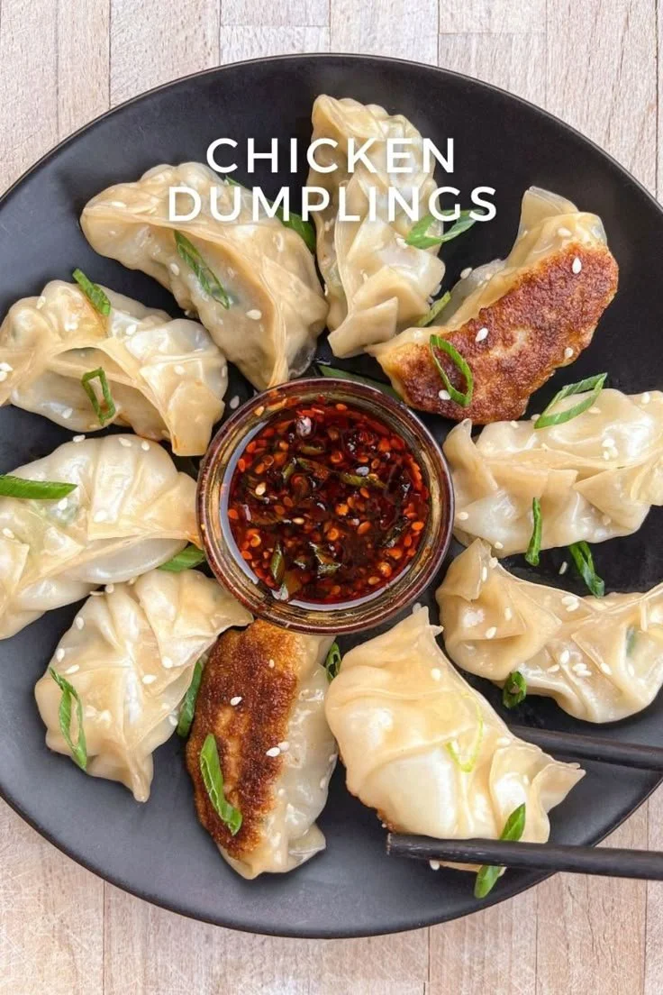 Homemade chicken dumplings being prepared in a kitchen setting.