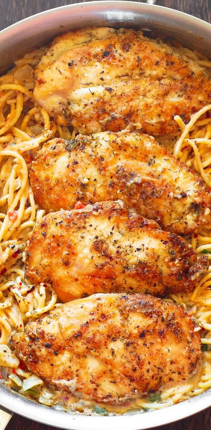 Italian Chicken Pasta in creamy white wine parmesan cheese sauce served in a bowl