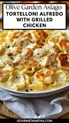 Olive Garden asiago tortelloni alfredo with grilled chicken served in a bowl.