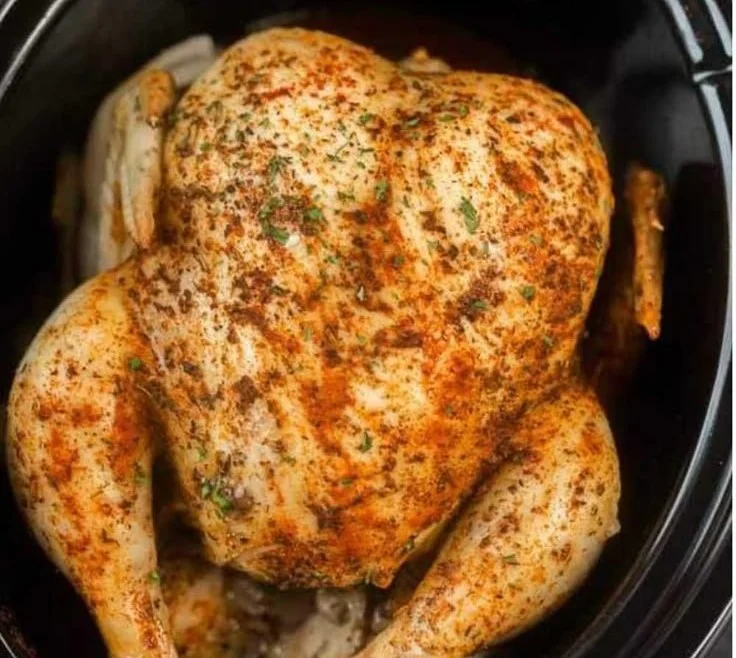 Slow cooker whole chicken seasoned and ready to serve