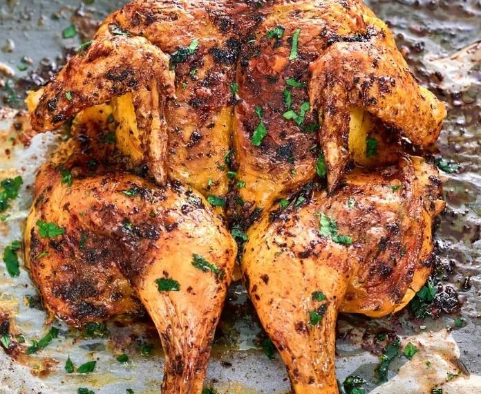 Plate of super juicy and crispy chicken served with sides