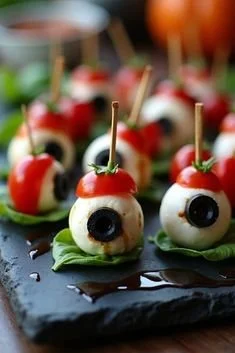 Creative Halloween finger food served on a spooky-themed platter.