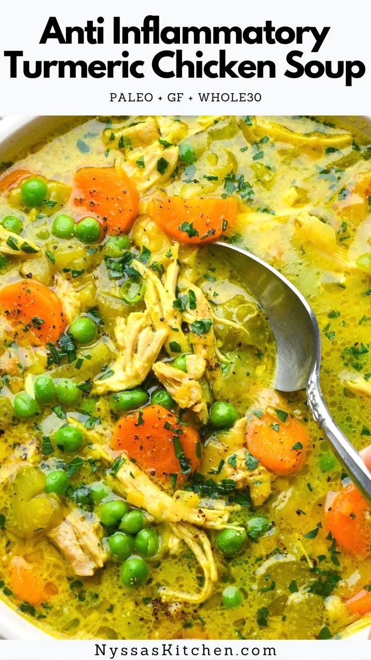 Bowl of anti-inflammatory turmeric chicken soup with fresh ingredients