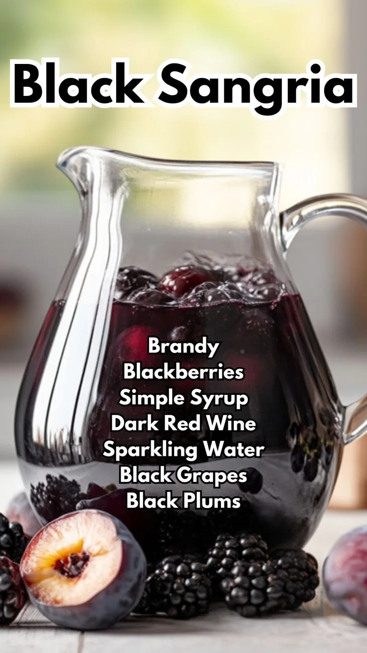 Refreshing glass of Black Sangria with fruits and ice