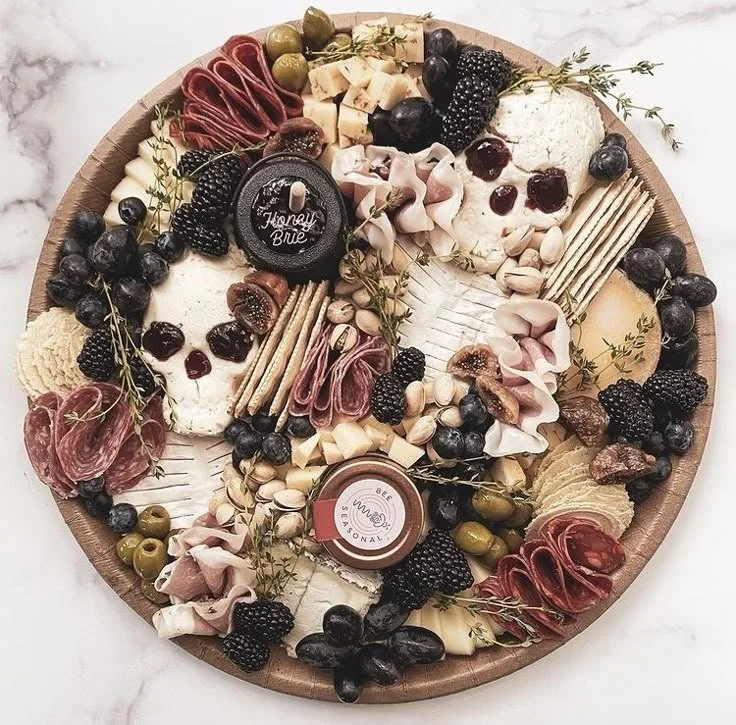 Delicious charcuterie platter with meats, cheeses, and olives in a gothic style.