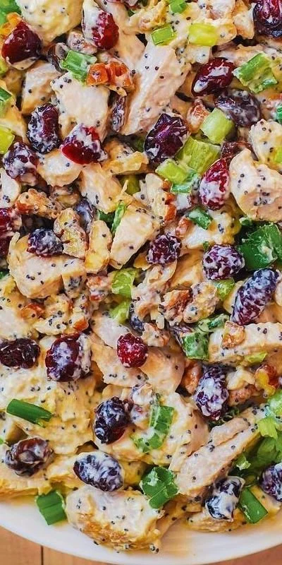 Cranberry pecan chicken salad with poppy seed dressing served in a bowl