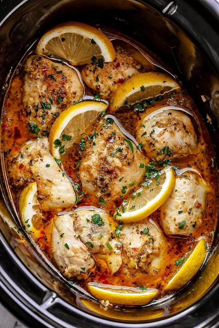 Easy garlic butter chicken thighs in a crock pot with lemon and garlic sauce