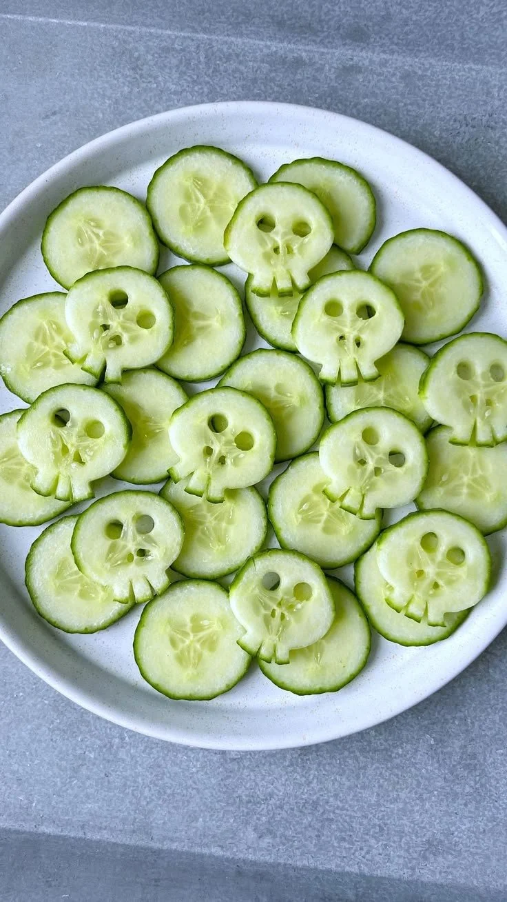 Healthy Halloween snacks featuring fun cucumber skulls for festive celebrations