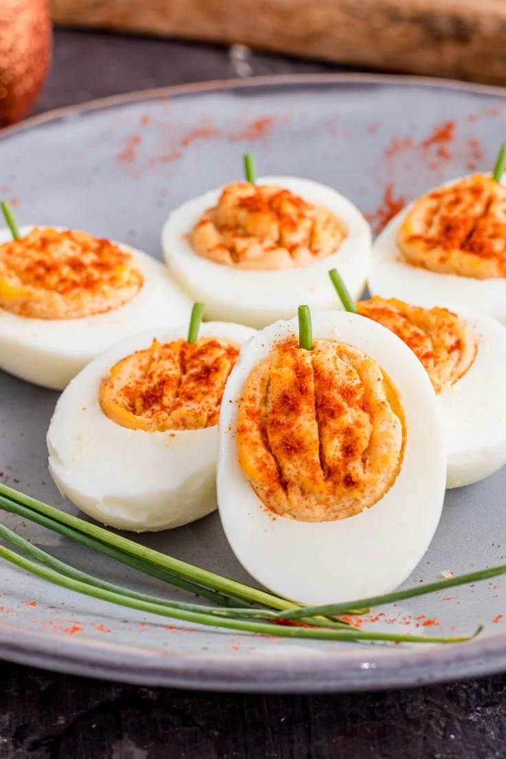 Festive pumpkin deviled eggs served on a platter for autumn celebrations