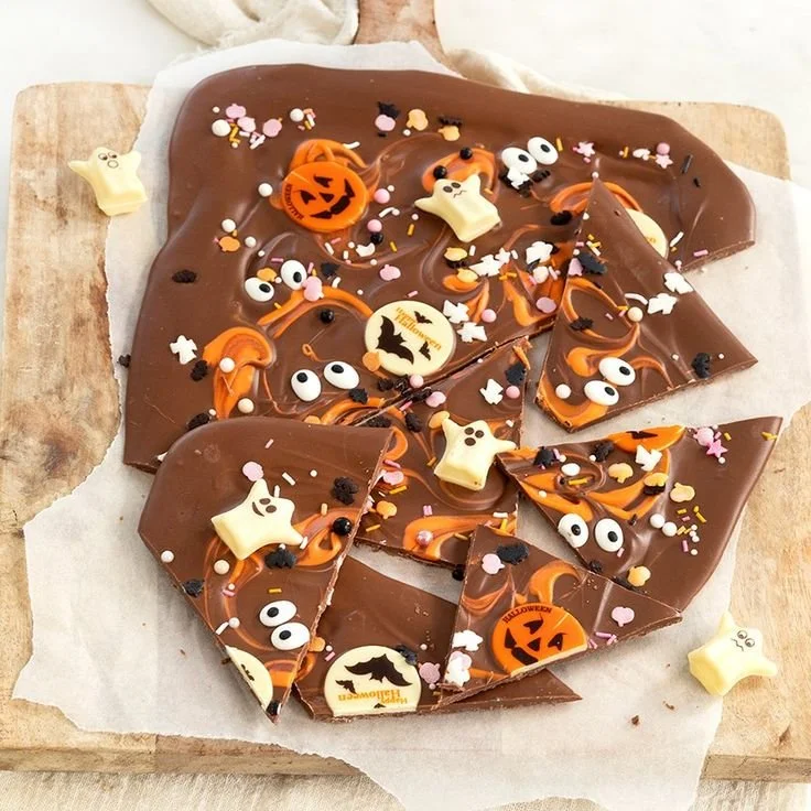 Colorful Halloween chocolate bark decorated with candy and spooky toppings