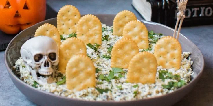 Halloween Graveyard Spinach Dip served in a spooky presentation