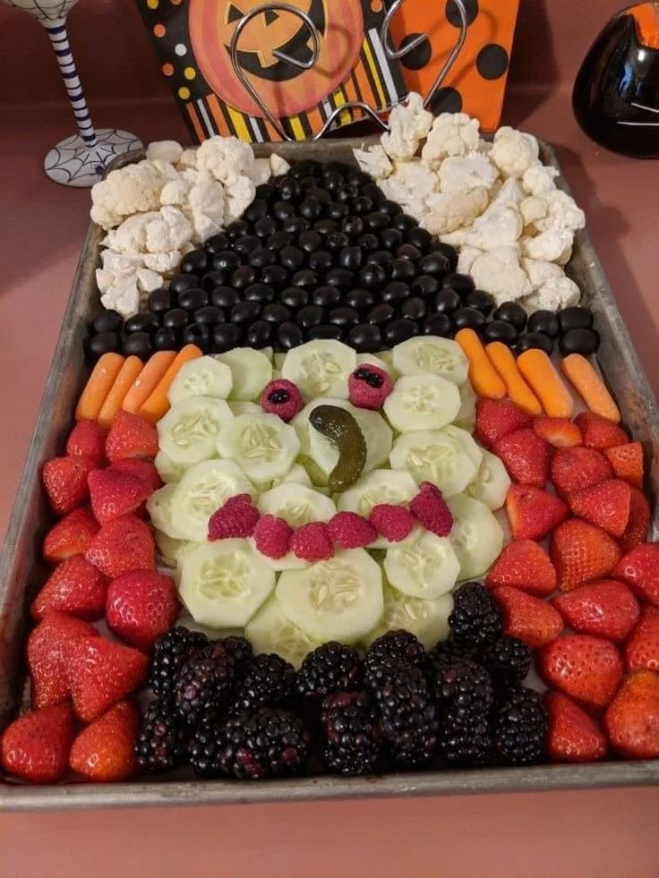 Spooky Halloween veggie tray shaped like a witch for festive gatherings