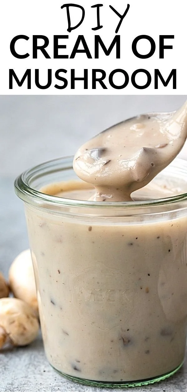 Bowl of homemade cream of mushroom soup garnished with fresh herbs