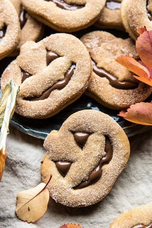 Oatmeal cookie cream pies decorated for Halloween, featuring autumn-themed elements.