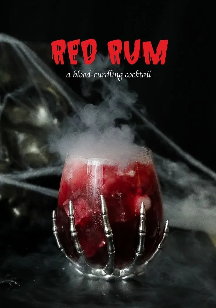 Red Rum Halloween cocktail garnished with spooky decor