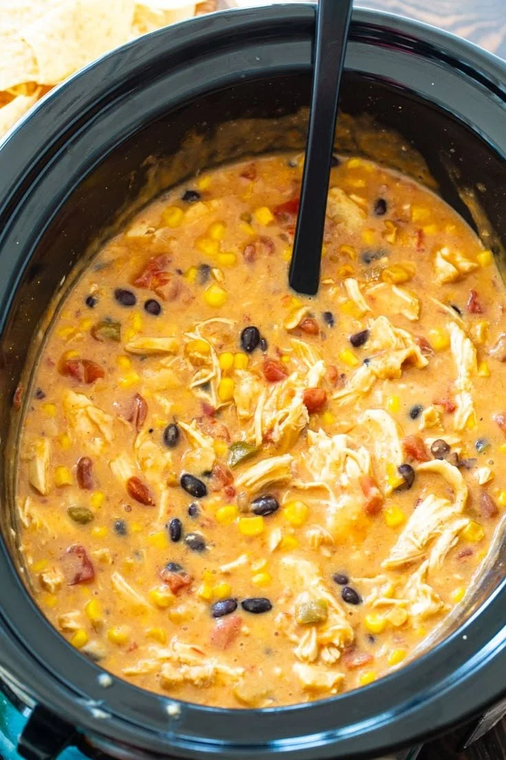Delicious Slow Cooker Chicken Tortilla Soup served in a bowl with toppings