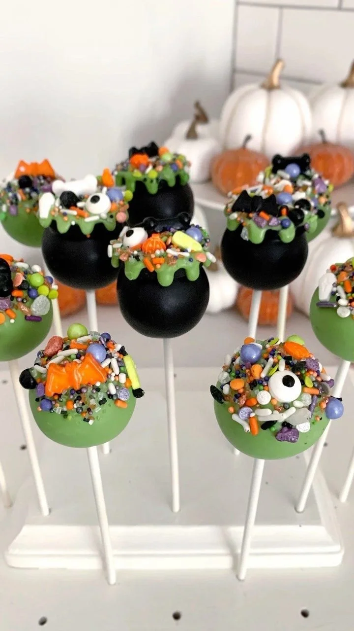 Colorful spooky cake pops for Halloween in various designs and colors