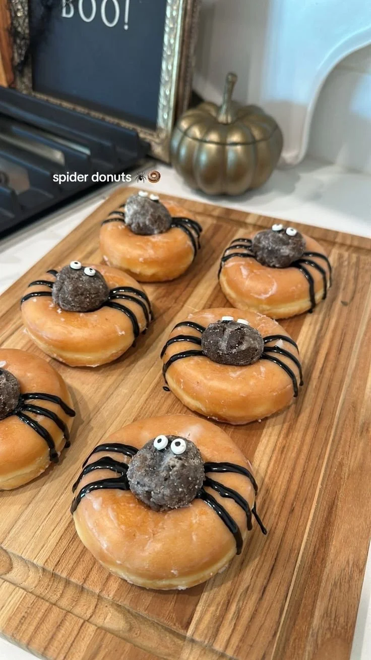 Spooky Halloween party food including spider donuts and Halloween snacks