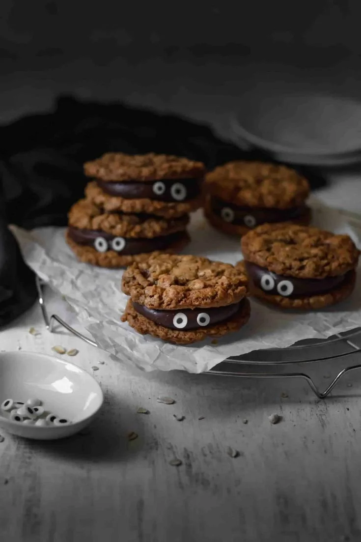 Batch of spooky Halloween cookies shaped like ghosts and pumpkins