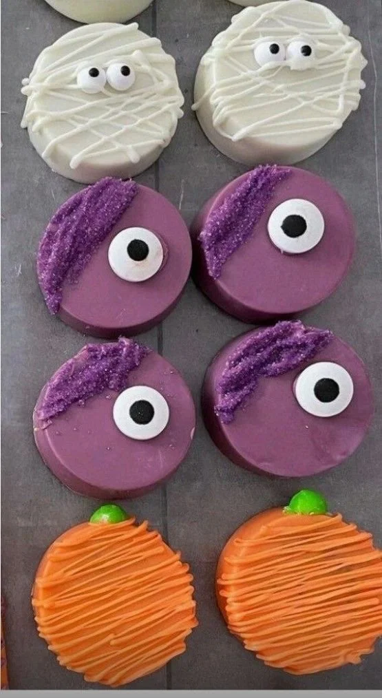 Spooky Halloween decorated cupcakes with festive toppings and designs