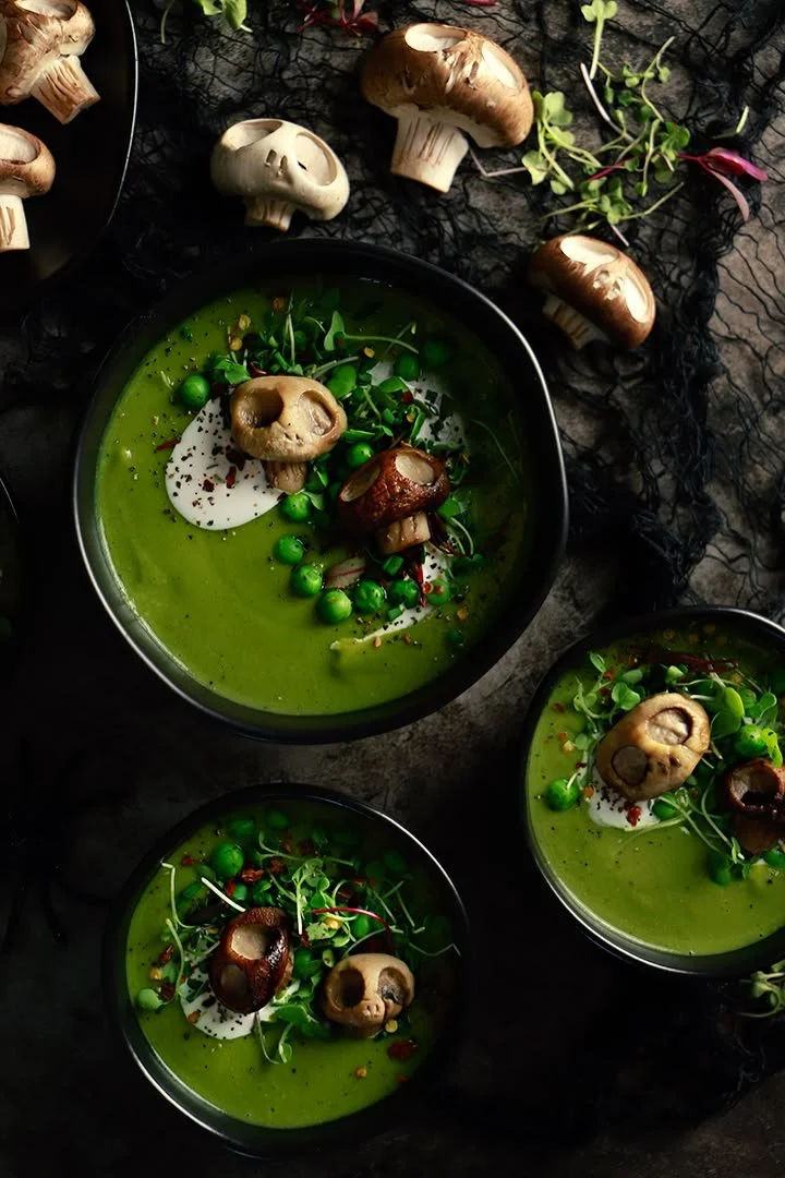 Bowl of Witches Brew Green Pea Soup with herbs and spices
